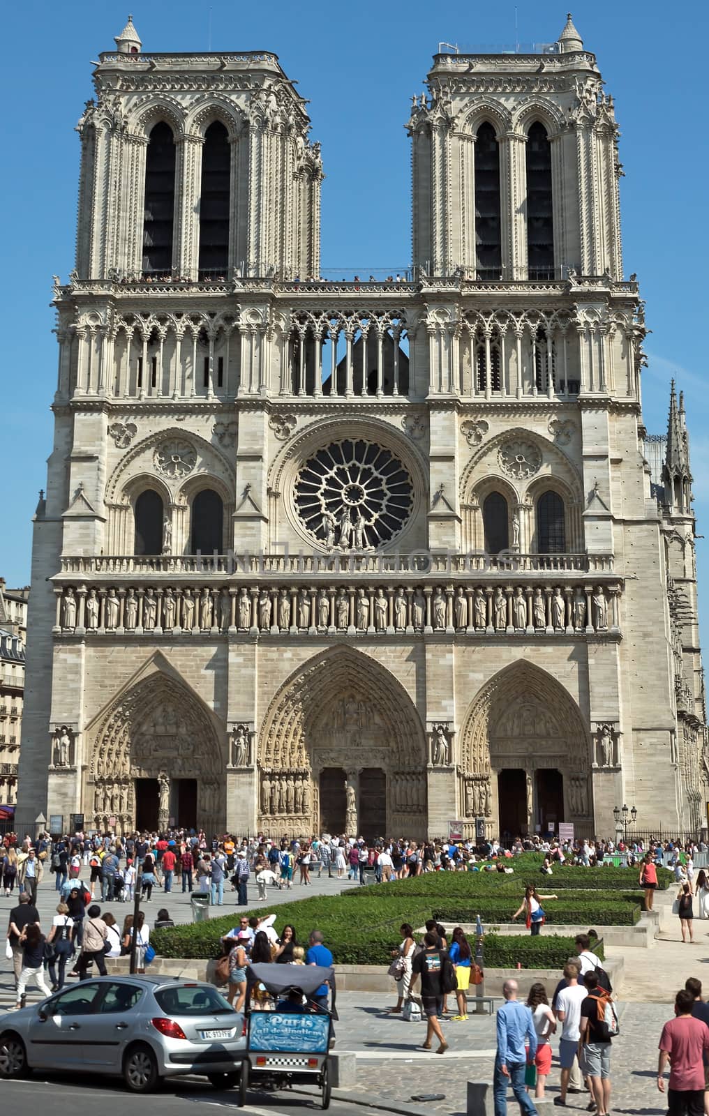 PARIS, FRANCE - JUNE 11, 2014: View of the Cathedral of Notre Dame in Paris, France.

Paris, France - June 11, 2014: View of the Cathedral of Notre Dame in Paris, France. People are visiting Cathedral.