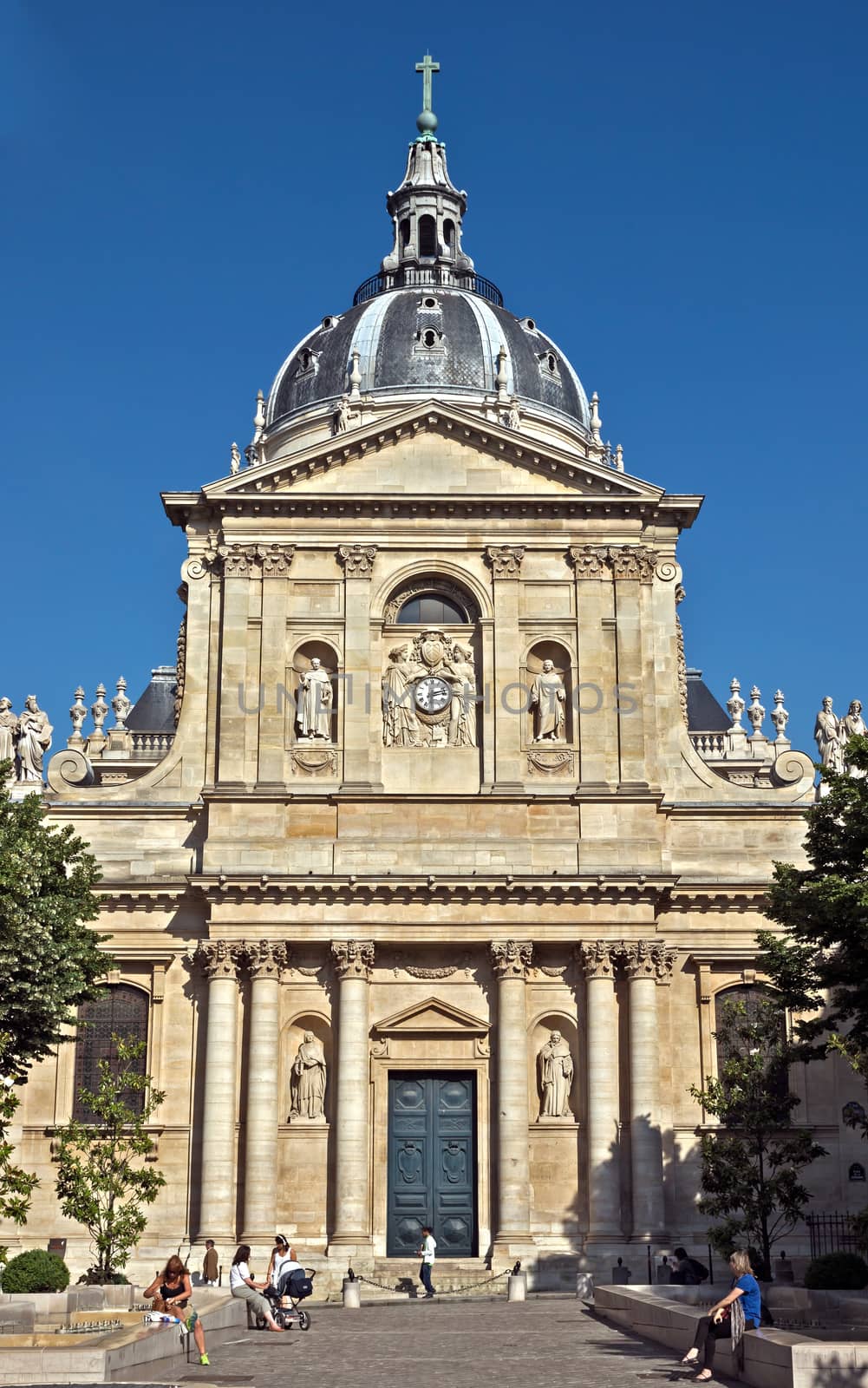 PARIS, FRANCE - JUNE 11, 2014: Sorbonne University in Latin Quarters, Paris. Name is derived from College de Sorbonne, founded by Robert de Sorbon (1257) - one of first colleges of medieval University.

Paris, France - June 11, 2014: Sorbonne University in Latin Quarters, Paris. Name is derived from College de Sorbonne, founded by Robert de Sorbon (1257) - one of first colleges of medieval University. People are resting near building.