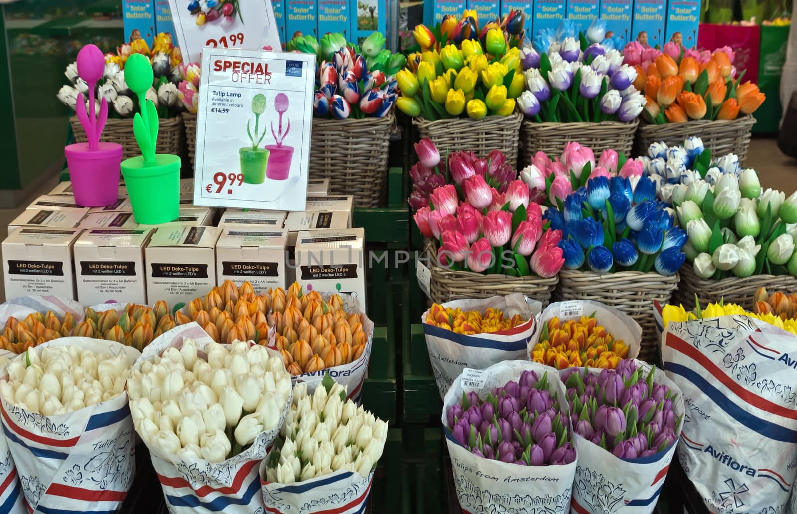 AMSTERDAM SCHIPHOL, THE NETHERLANDS - JUNE 12, 2014: Colorful tulips for sale in Amsterdam Schiphol airport.

Amsterdam Schiphol, The Netherlands - June 12, 2014: Colorful tulips for sale in Amsterdam Schiphol airport.