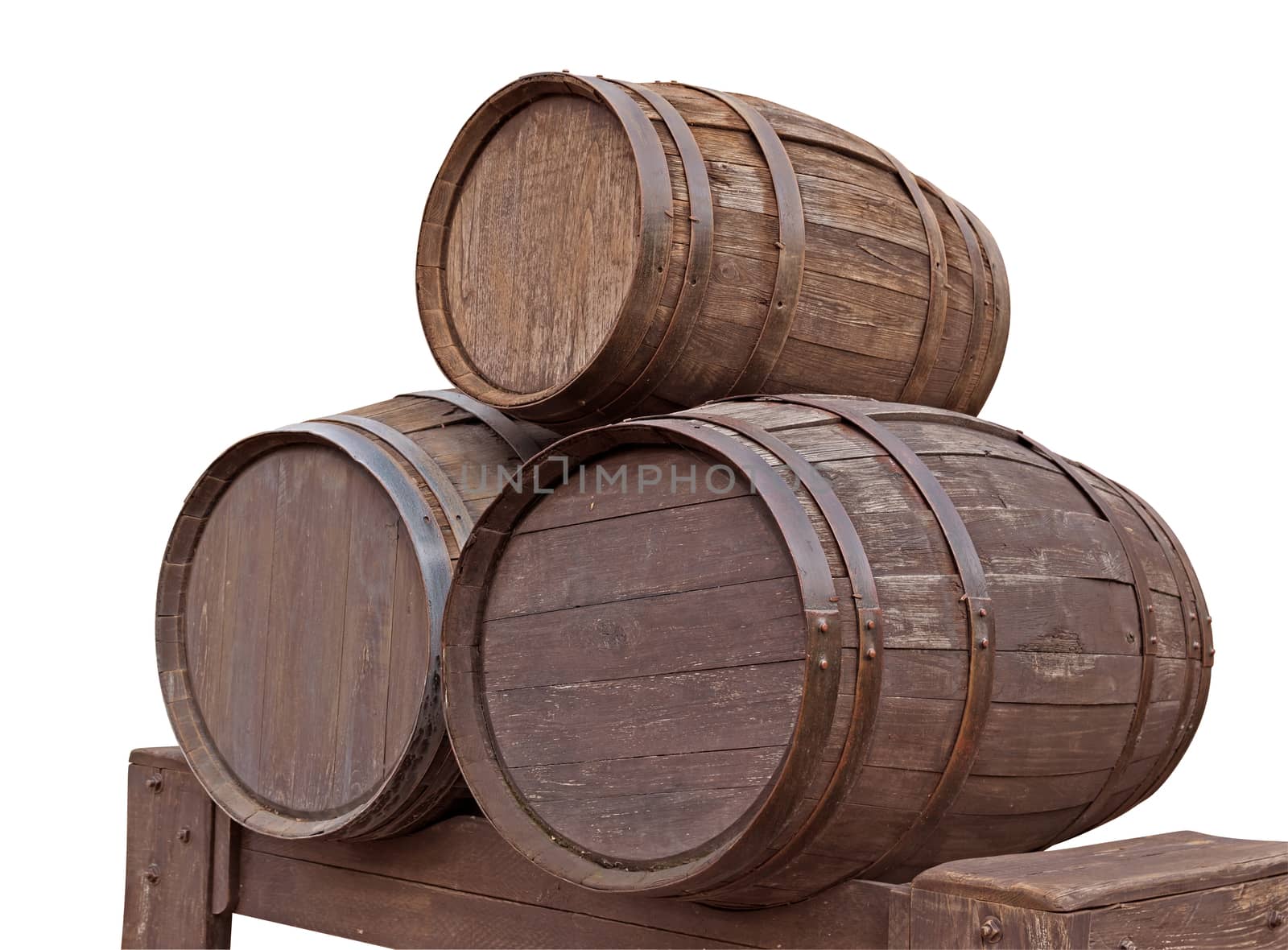 Three wooden barrels for wine with steel ring isolated on white. Clipping path included.