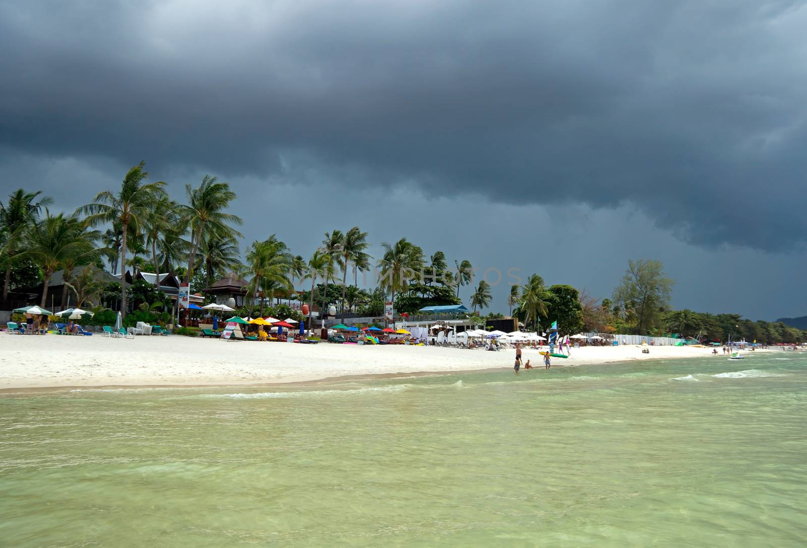 KOH SAMUI, THAILAND - JULY 30: View at the Chaweng Beach before storm on July 30, 2013 in Koh Samui, Thailand. People are sunbathing on the Chaweng beach in Koh Samui.

Koh Samui, Thailand - July 30, 2013: View at the Chaweng Beach before storm. People are sunbathing on the Chaweng beach in Koh Samui.