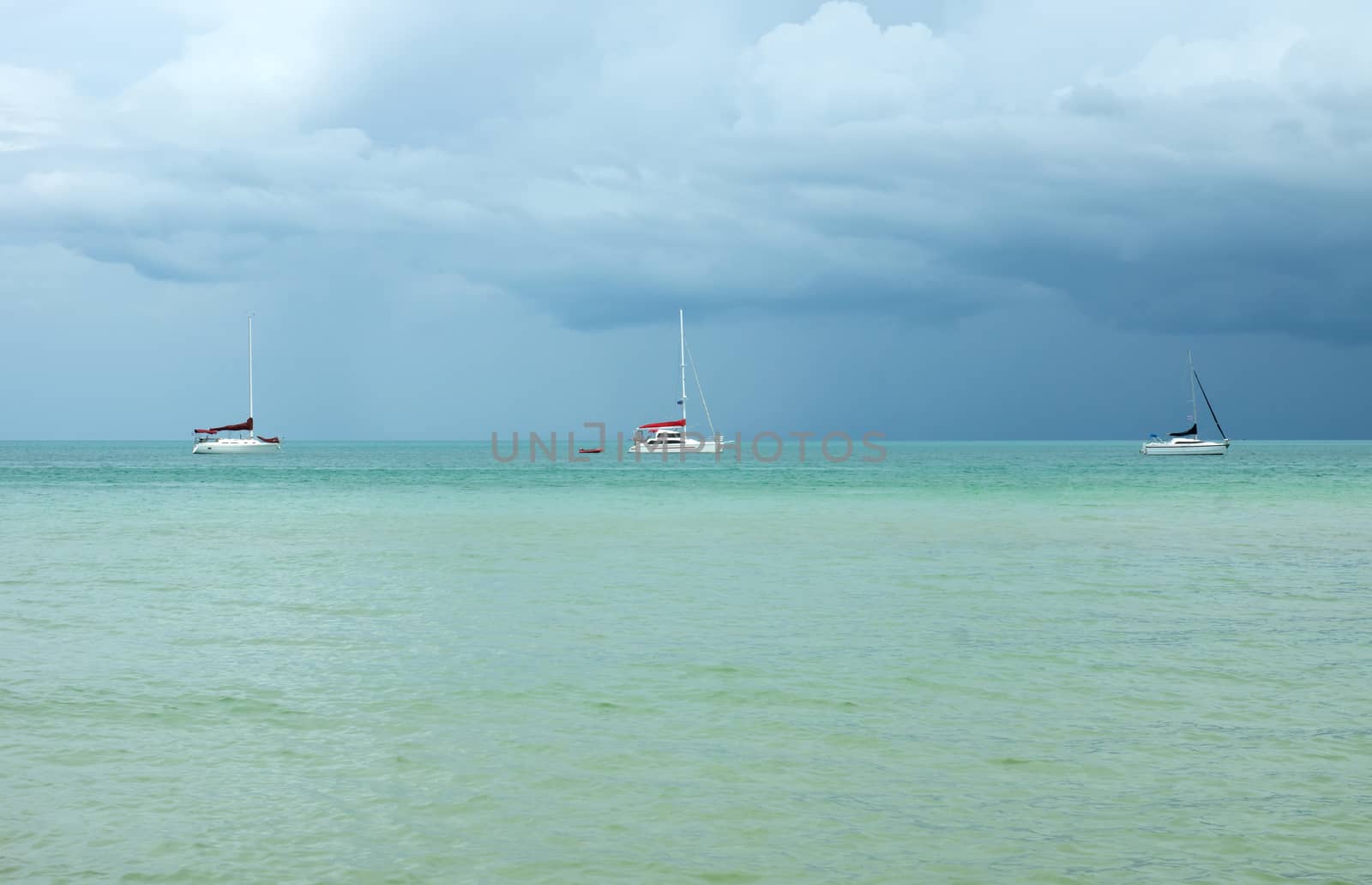 Three yachts on the Mediterranean Sea before storm