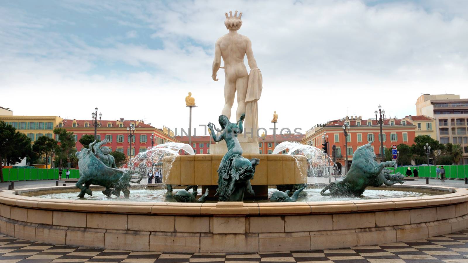 NICE, FRANCE - APRIL 27: View to Place Massena and fountain Soleil on April 27, 2013 in Nice, France. The square was reconstructed in 1979.

Nice, France - April 27, 2013: View to Place Massena and fountain Soleil. Square is located in the city center and is the most popular destination among tourists. The square was reconstructed in 1979.