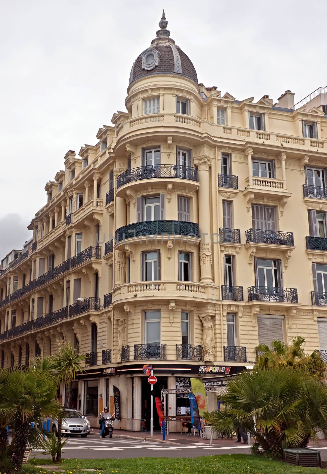 NICE, FRANCE - APRIL 27: Architecture along Promenade des Anglais on April 27, 2013 in Nice, France. It is a symbol of the Cote d'Azur and was built in 1830 at the expense of the British colony.

Nice, France - April 27, 2013: Architecture along Promenade des Anglais. Promenade des Anglais is a symbol of the Cote d'Azur and was built in 1830 at the expense of the British colony.