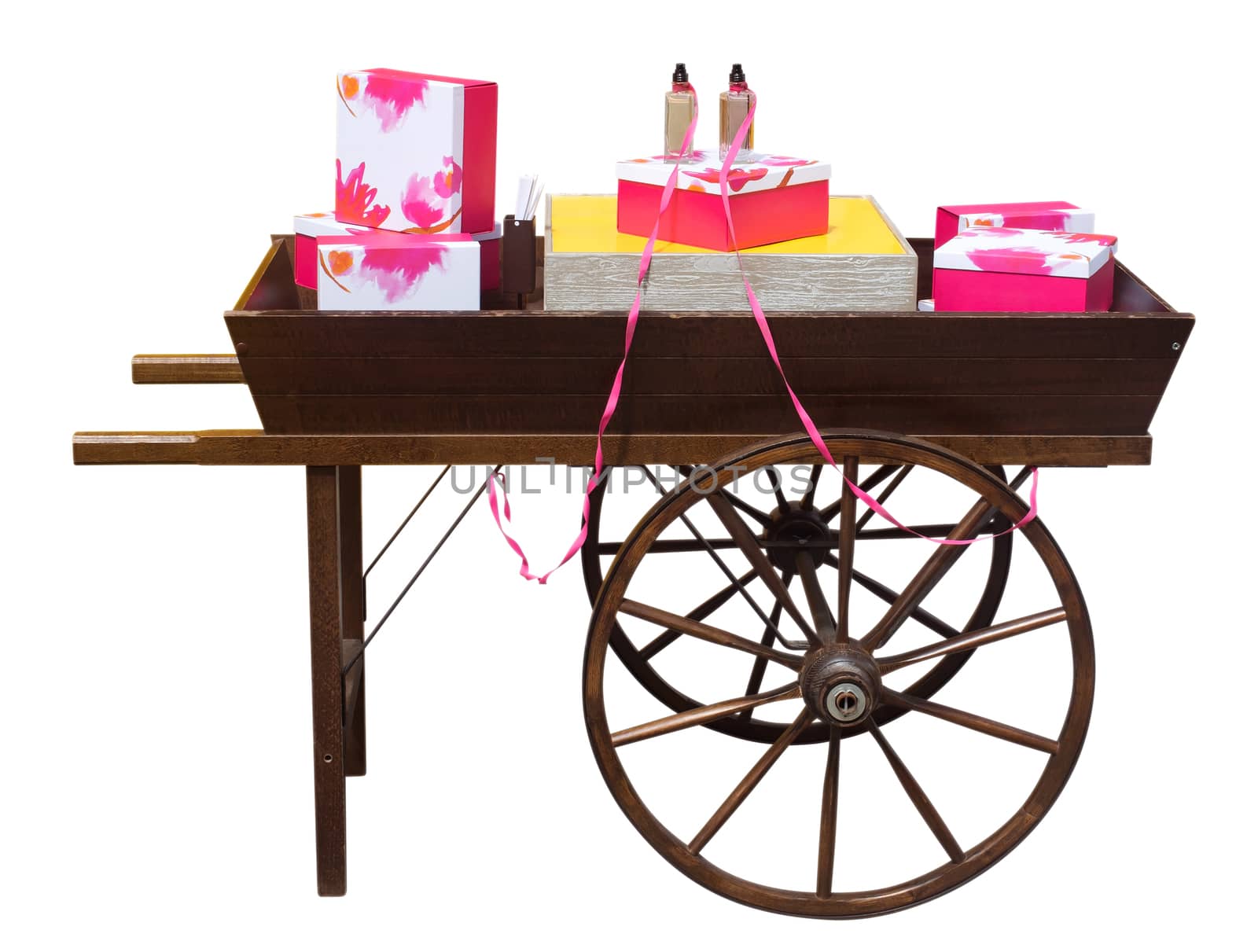 Wooden cart with gifts of perfume isolated on white. Clipping path included.