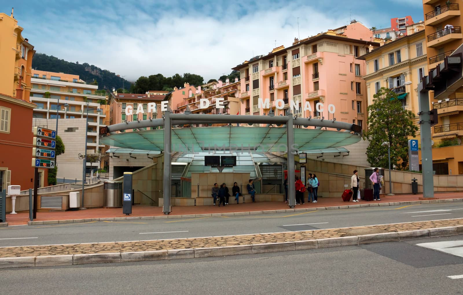 MONTE CARLO, MONACO - APRIL 28: The train station Monaco-Ville of Monaco on April 28, 2013 in Monte Carlo, Monaco. There are no airports in Monaco and the only way to get there is by railroad, roads or the sea.

Monte Carlo, Monaco - April 28, 2013: The train station Monaco-Ville of Monaco. People are waiting for the arrival of transport. There are no airports in Monaco and the only way to get there is by railroad, roads or the sea.