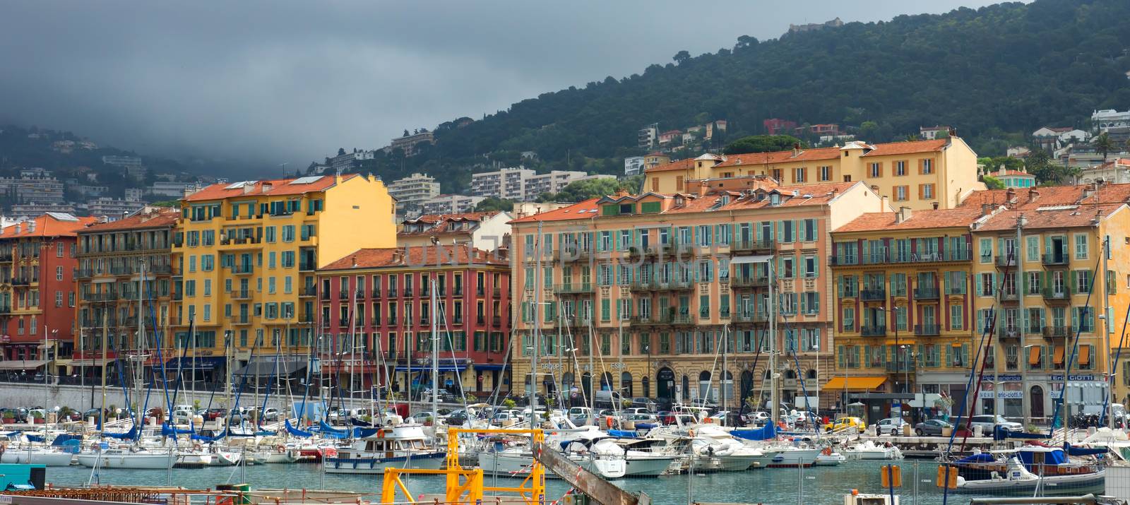 NICE, FRANCE - APRIL 27: Colorful buildings and boats within a Port de Nice on April 27, 2013 in Nice, France. Port de Nice was started in 1745.

Nice, France - April 27, 2013 : Colorful buildings and boats within a Port de Nice in French Riviera. Port de Nice was started in 1745.
Colorful buildings and boats within a harbor in beautiful Villefranche, France