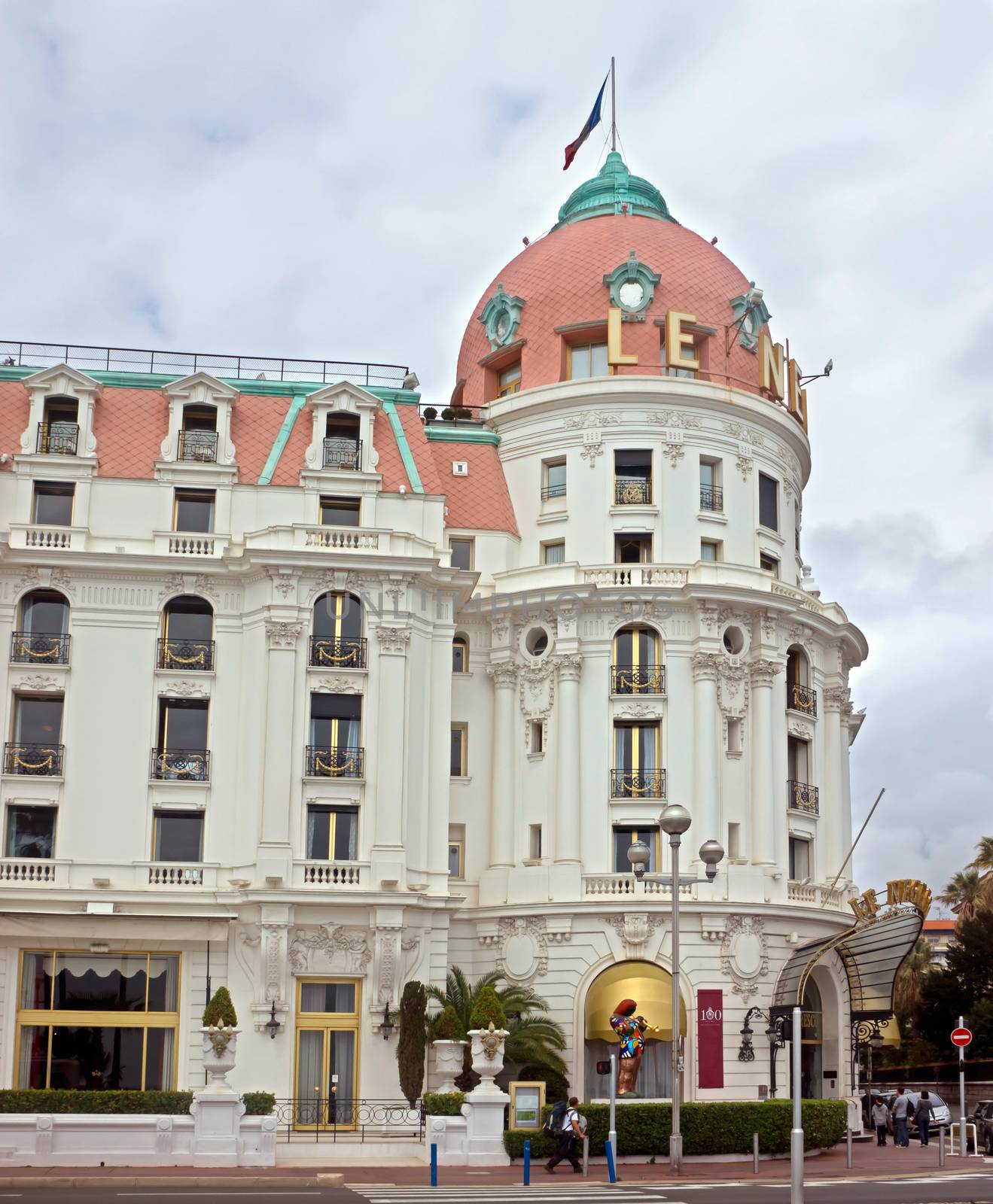 NICE, FRANCE - APRIL 27: Luxury Hotel Negresco on April 27, 2013 in Nice, France. Hotel Negresco is the famous luxury hotel on the Promenade des Anglais in Nice, a symbol of the Cote d'Azur.

Nice, France - April 27, 2013: Luxury Hotel Negresco on English Promenade in Nice, French Riviera. Hotel Negresco is the famous luxury hotel on the Promenade des Anglais in Nice, a symbol of the Cote d'Azur.