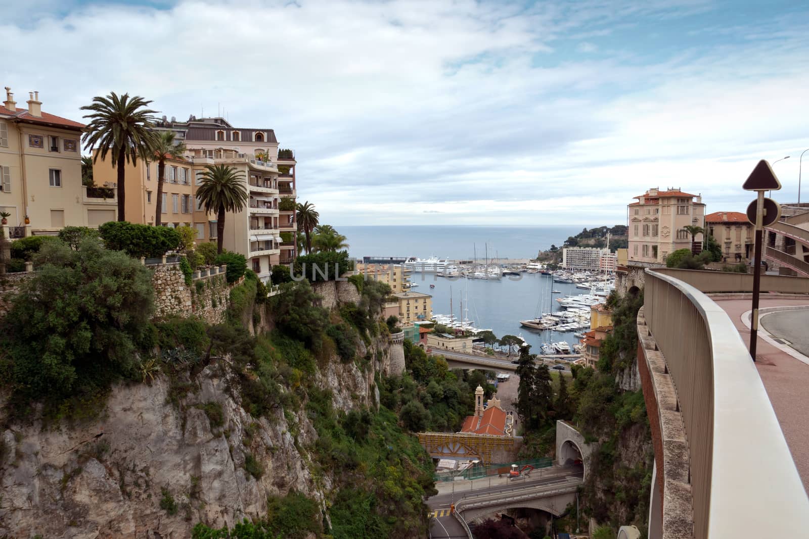MONTE CARLO, MONACO - APRIL 28: View of the harbor from the train station Monaco-Ville on April 28, 2013 in Monte Carlo, Monaco. 

Monte Carlo, Monaco - April 28, 2013: View of the harbor from the train station Monaco-Ville