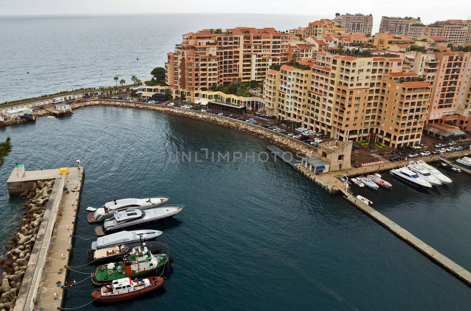 MONTE CARLO, MONACO - APRIL 28: Architecture Fontvieille district on April 28, 2013 in Monte Carlo, Monaco. Lands for the district have been reclaimed from the sea.

Monte Carlo, Monaco - April 28, 2013: Architecture Fontvieille district.  Lands for the district have been reclaimed from the sea.