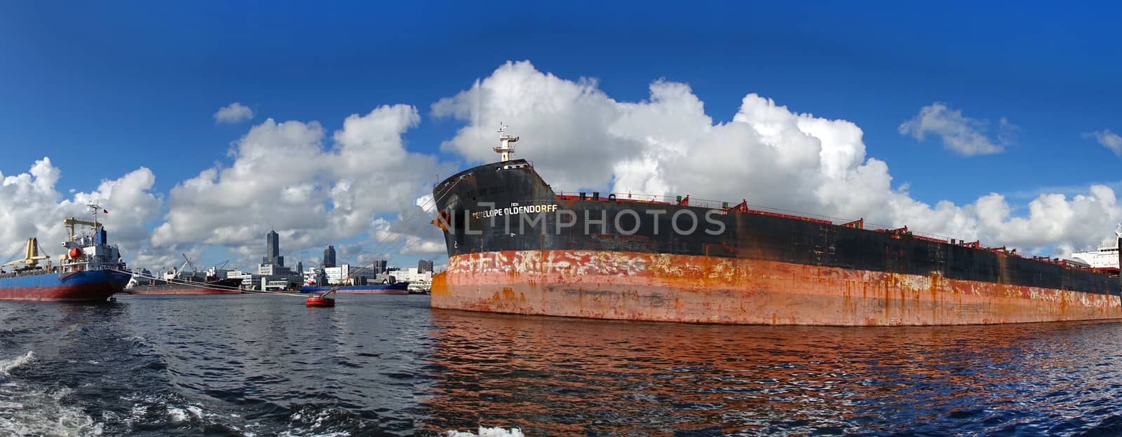 KAOHSIUNG, TAIWAN -- JUNE 2, 2019: Two large cargo ships are docked in Kaohsiung Port