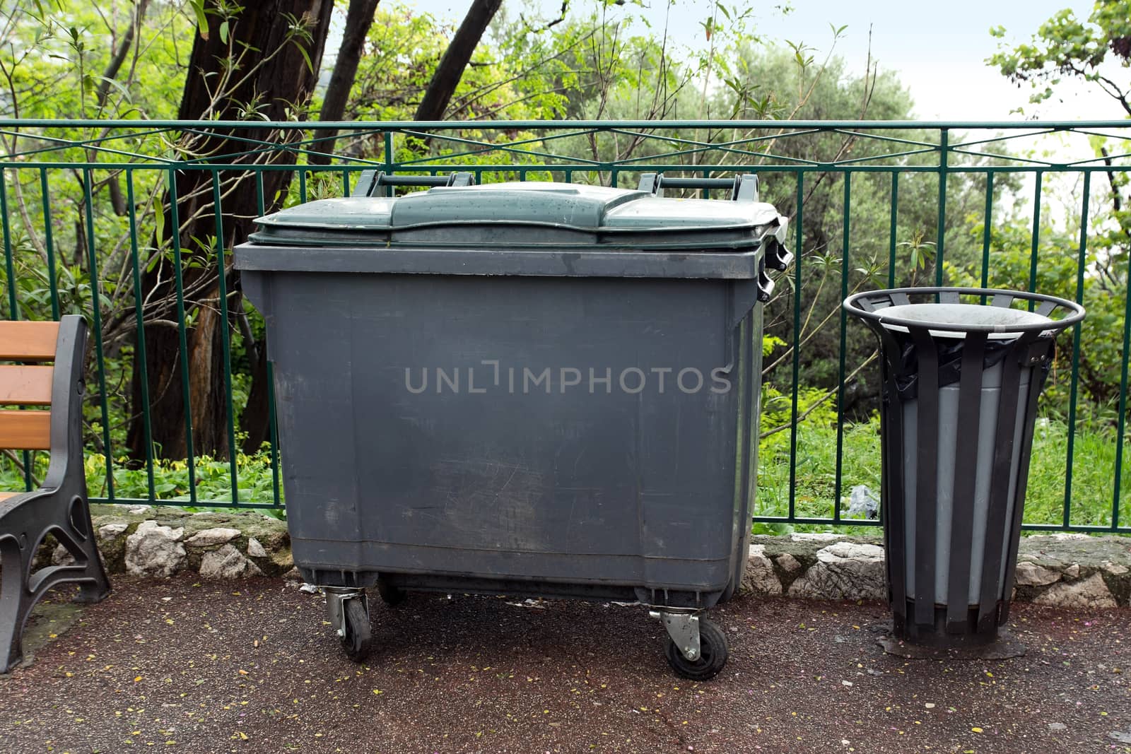 Trash container and basket at the park