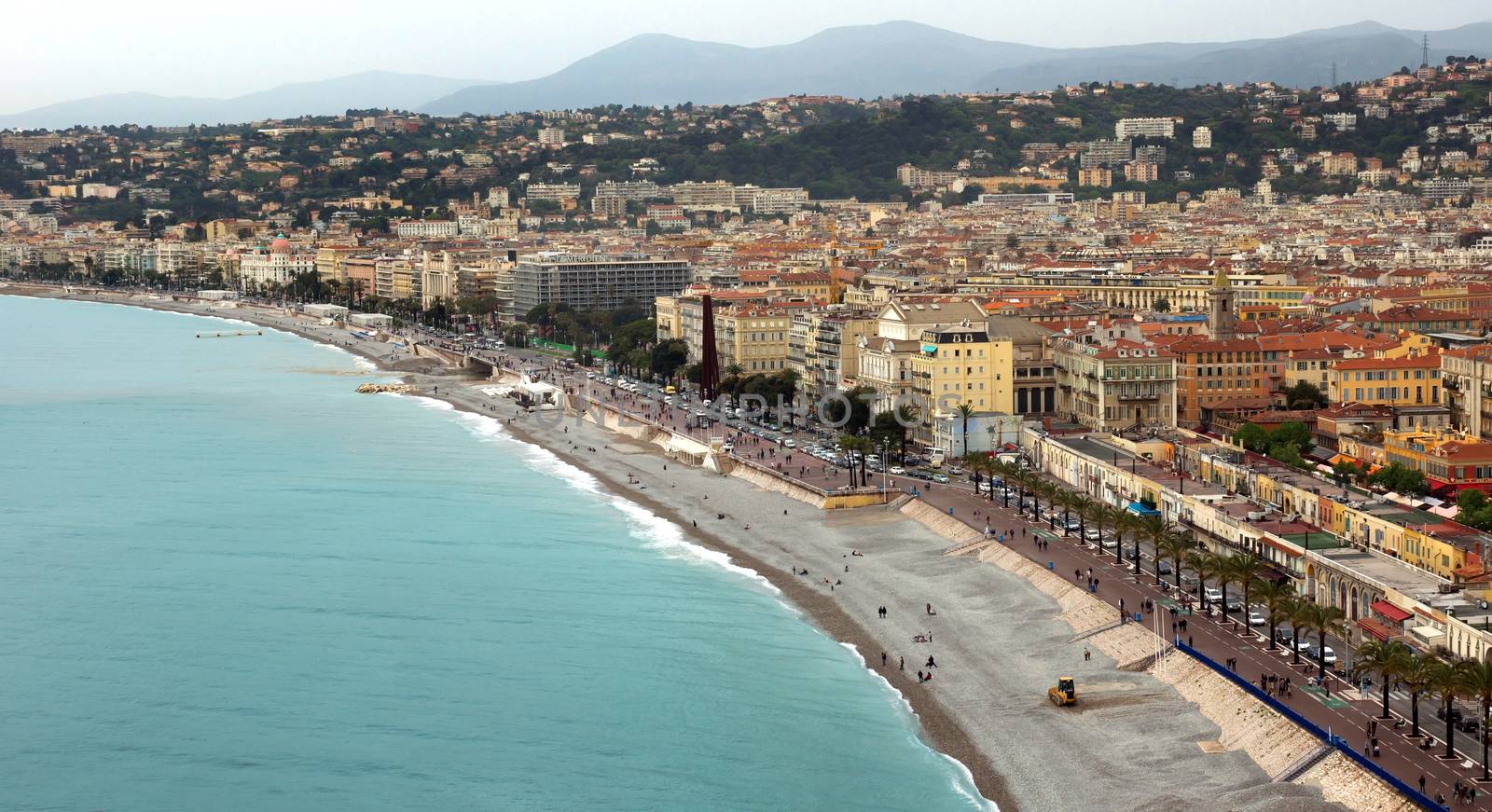 NICE, FRANCE - APRIL 29: Panoramic view of Promenade des Anglais on April 29, 2013 in Nice, France. It is a symbol of the Cote d'Azur and was built in 1830 at the expense of the British colony.

Nice, France - April 29, 2013: Panoramic view of Promenade des Anglais. Promenade des Anglais is a symbol of the Cote d'Azur and was built in 1830 at the expense of the British colony.