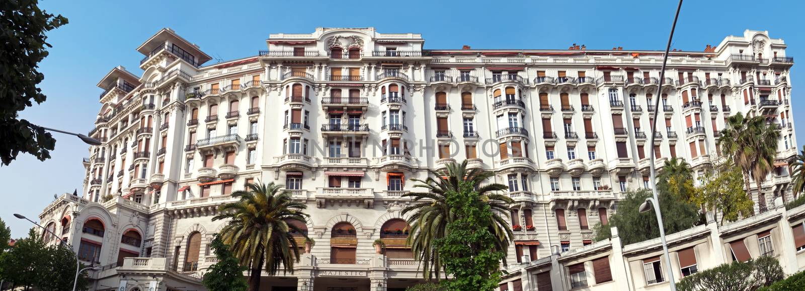 NICE, FRANCE - APRIL 30: Luxury Hotel Le Majestic on April 30, 2013 in Nice, France. Hotel Le Majestic is the famous luxury hotel near the Promenade des Anglais in Nice, a symbol of the Cote d'Azur.

Nice, France - April 30, 2013: Luxury Hotel Le Majestic in Nice, French Riviera. Hotel Le Majestic is the famous luxury hotel near the Promenade des Anglais in Nice, a symbol of the Cote d'Azur.