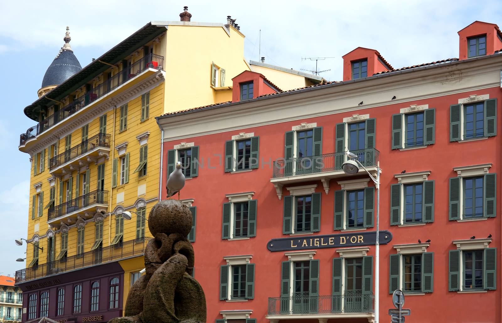 NICE, FRANCE - APRIL 30: External view on the colorful  buildings at the downtown on April 30, 2013 in Nice, France. 

Nice, France - April 30, 2013: External view on the colorful  buildings at the downtown.