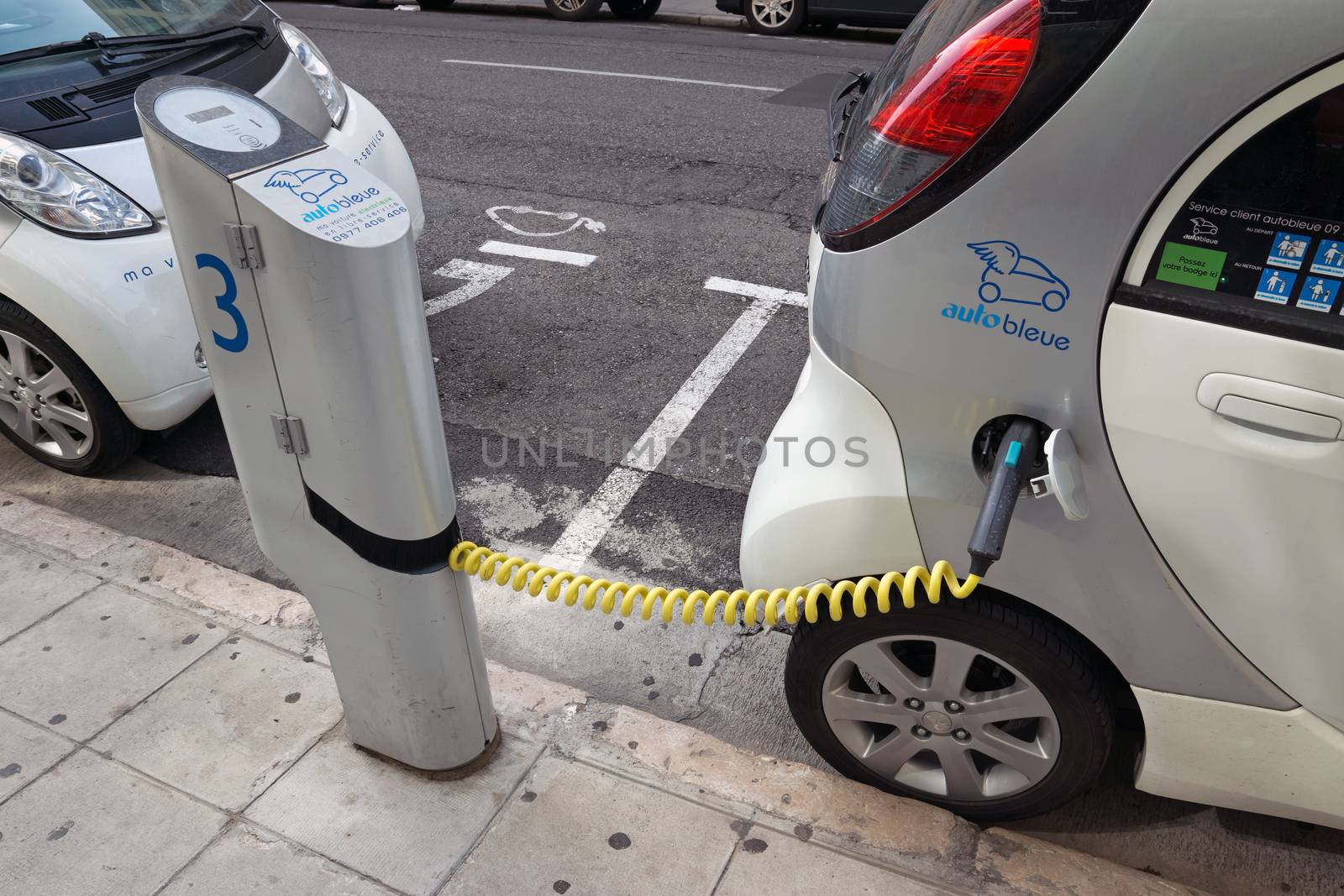 NICE - MAY 1: Electric cars at a charging station on May 1, 2013 in Nice, France.

Nice, France - May 1, 2013: Two electric cars charging on a street in the city of Nice.