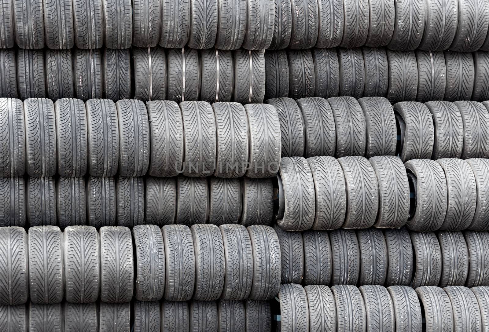 Stack of spare tires for racing, Monte Carlo, Monaco. 

MONTE CARLO, MONACO - MAY 1: Spare tires for racing The Monaco Grand Prix on May 1, 2013 in Monte Carlo, Monaco. Motor race held each year on the Circuit de Monaco. 