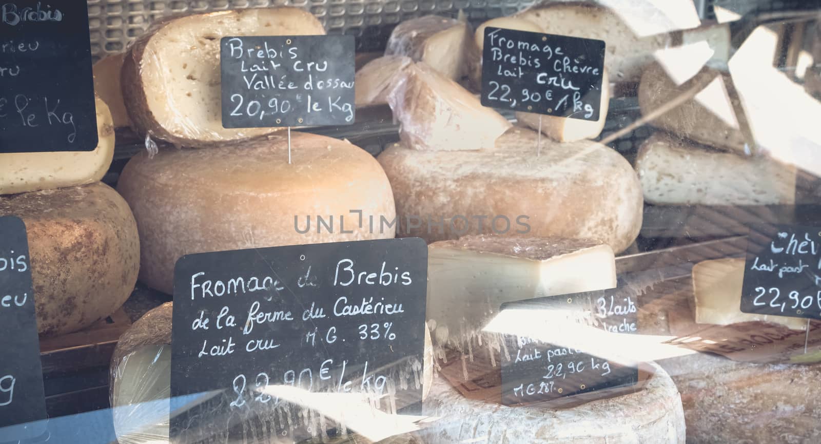 Showcase of a small cheese merchant on a mountain market by AtlanticEUROSTOXX