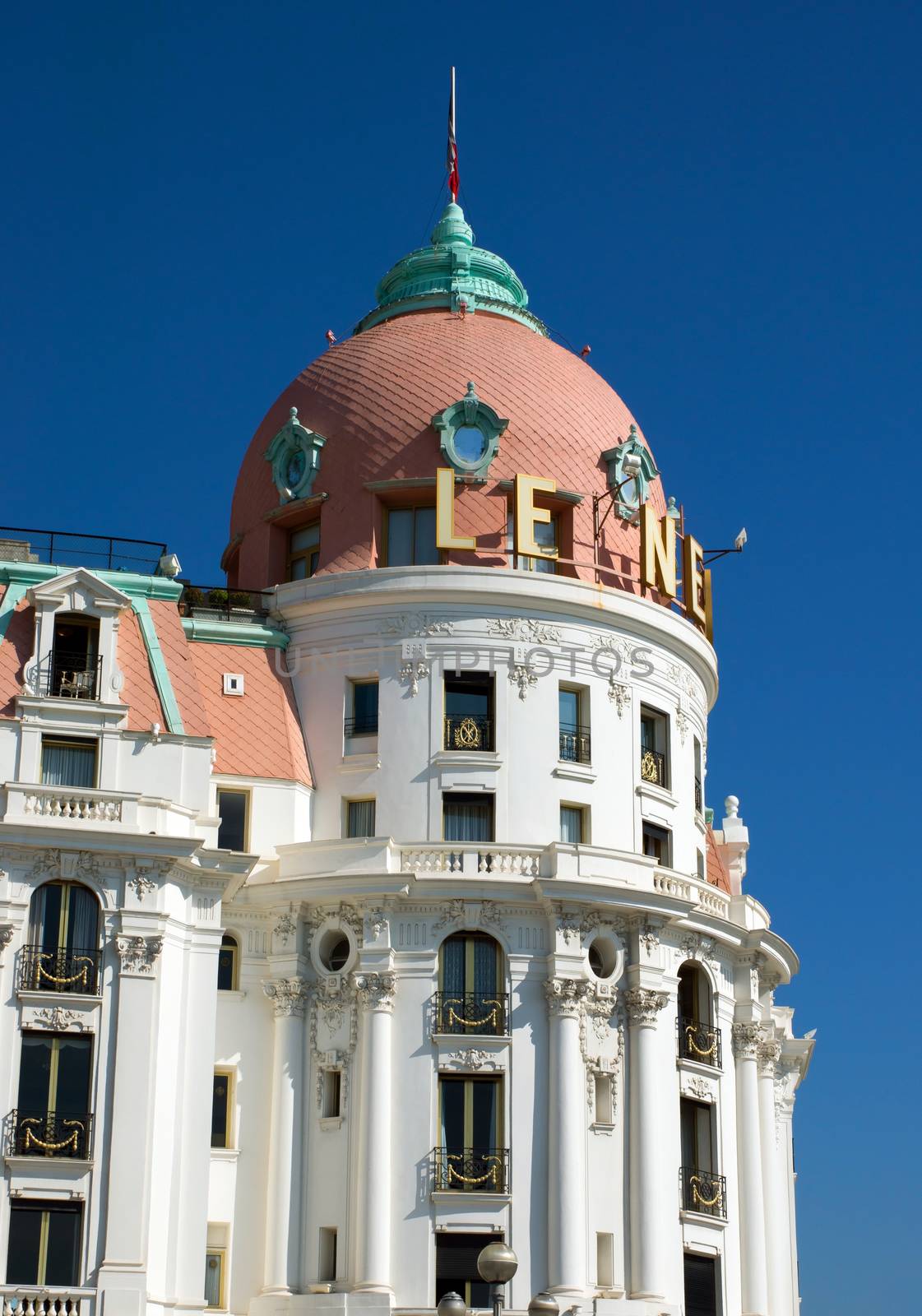 NICE, FRANCE - MAY 4: Luxury Hotel Negresco on May 4, 2013 in Nice, France. Hotel Negresco is the famous luxury hotel on the Promenade des Anglais in Nice, a symbol of the Cote d'Azur.

Nice, France - May 4, 2013: Luxury Hotel Negresco on English Promenade in Nice, French Riviera. Hotel Negresco is the famous luxury hotel on the Promenade des Anglais in Nice, a symbol of the Cote d'Azur