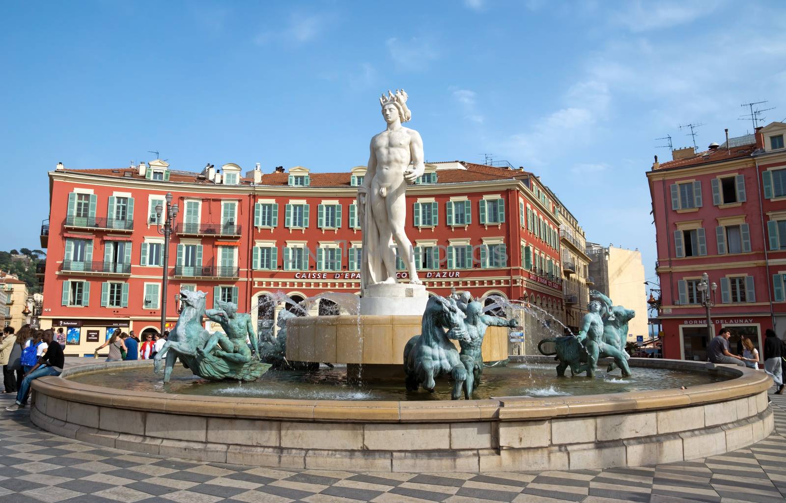NICE, FRANCE - MAY 2:  Fountain Soleil on Place Massena on May 2, 2013 in Nice, France. The square was reconstructed in 1979.

Nice, France - May 2, 2013: Fountain Soleil on Place Massena. Square is located in the city center and is the most popular destination among tourists. The square was reconstructed in 1979. There are many boutiques, cafes and restaurants.