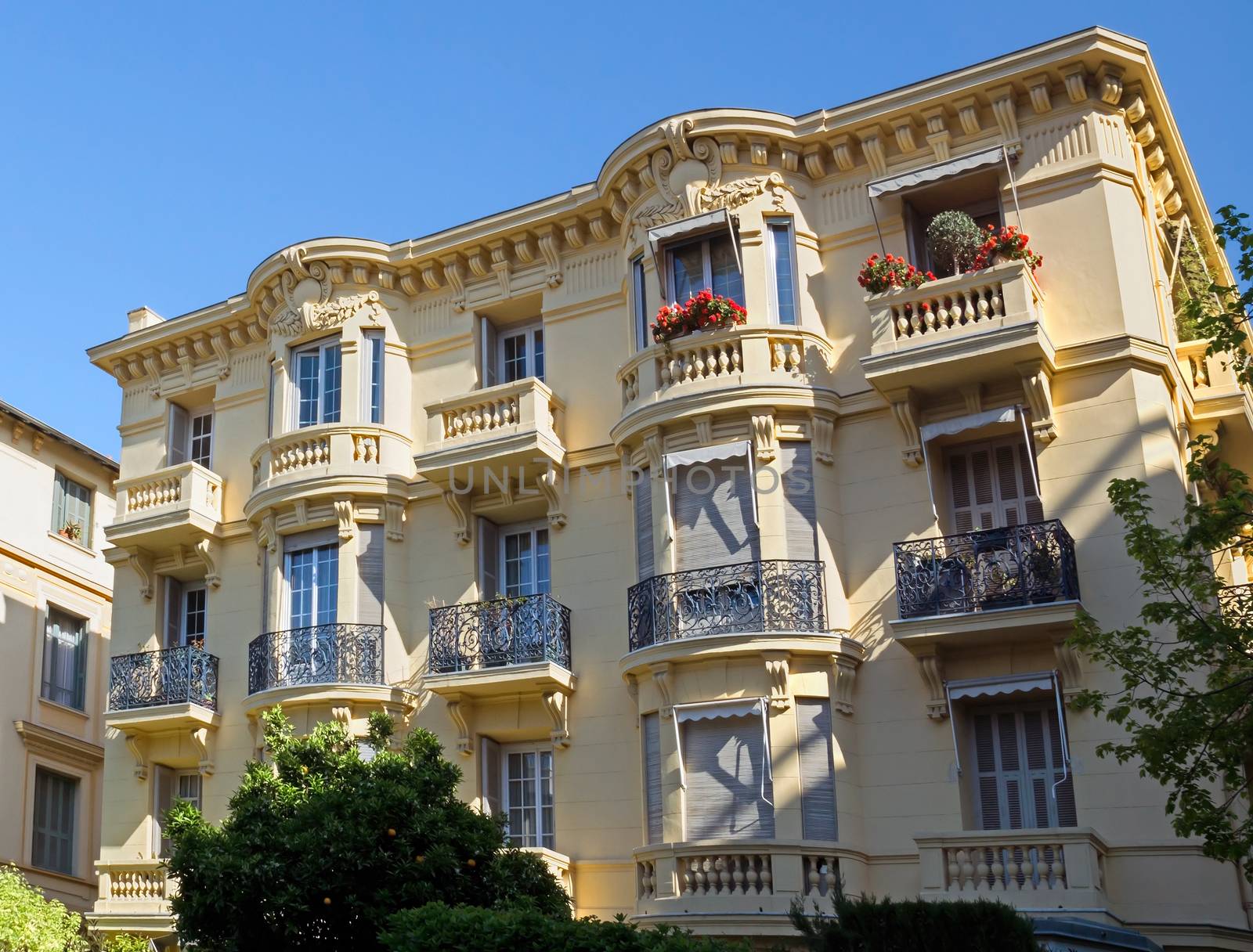 NICE, FRANCE - MAY 4: Architecture along Promenade des Anglais on May, 4, 2013 in Nice, France. It is a symbol of the Cote d'Azur and was built in 1830 at the expense of the British colony.

Nice, France - May 4, 2013: Architecture along Promenade des Anglais. People are walking. Promenade des Anglais is a symbol of the Cote d'Azur and was built in 1830 at the expense of the British colony.