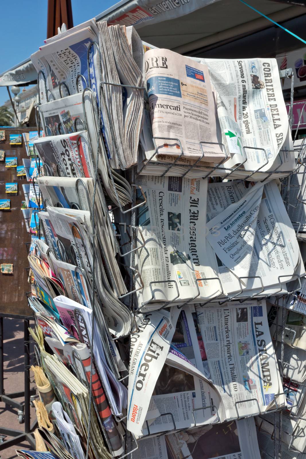 City of Nice - Newspapers on sale in a newsstand by Venakr
