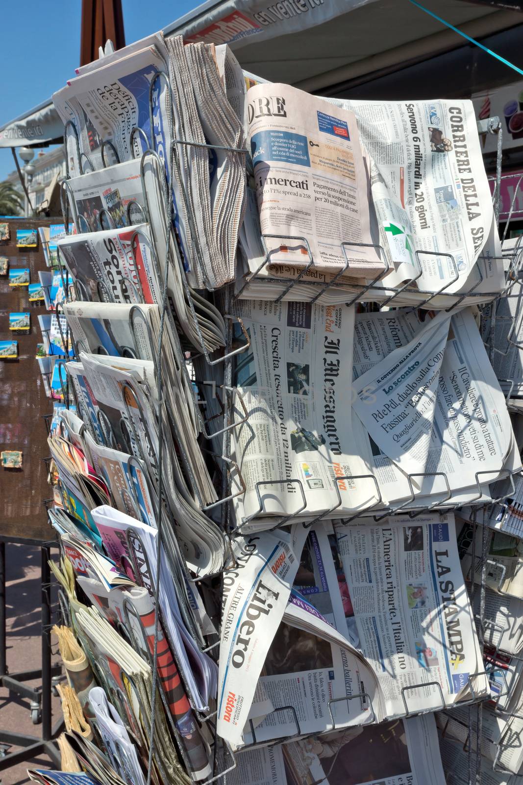 NICE, FRANCE - MAY 4: Newspapers on sale in a newsstand on May 4, 2013 in Nice, France. France has about 800 periodicals offering political and general features, 500 others that present general news, 2,000 technical publications. 

Nice, France - May 4, 2013: Newspapers on sale in a newsstand. France has about 800 periodicals offering political and general features, 500 others that present general news, 2,000 technical publications.