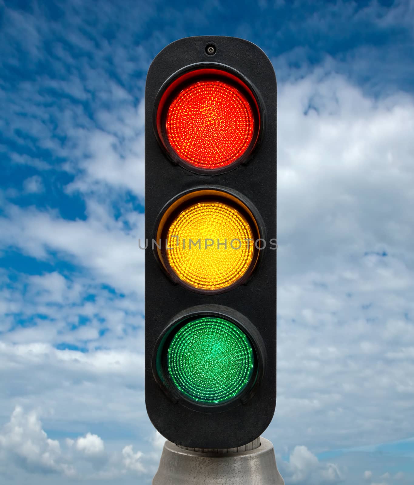 Red Yellow and Green traffic lights against blue sky backgrounds. Clipping Path included.