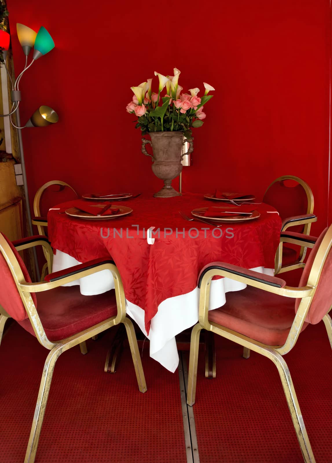 Restaurant on the street in Cannes with tables and chairs set for a meal