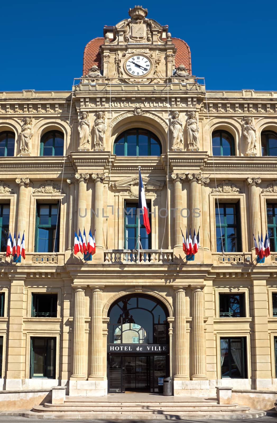 CANNES, FRANCE - MAY 6: Hotel de Ville on May 6, 2013 in Cannes, France. It is located along the Croisette, and was built in 1874.

Cannes, France - May 6, 2013: Hotel de Ville.  It is located along the Croisette, and was built in 1874.