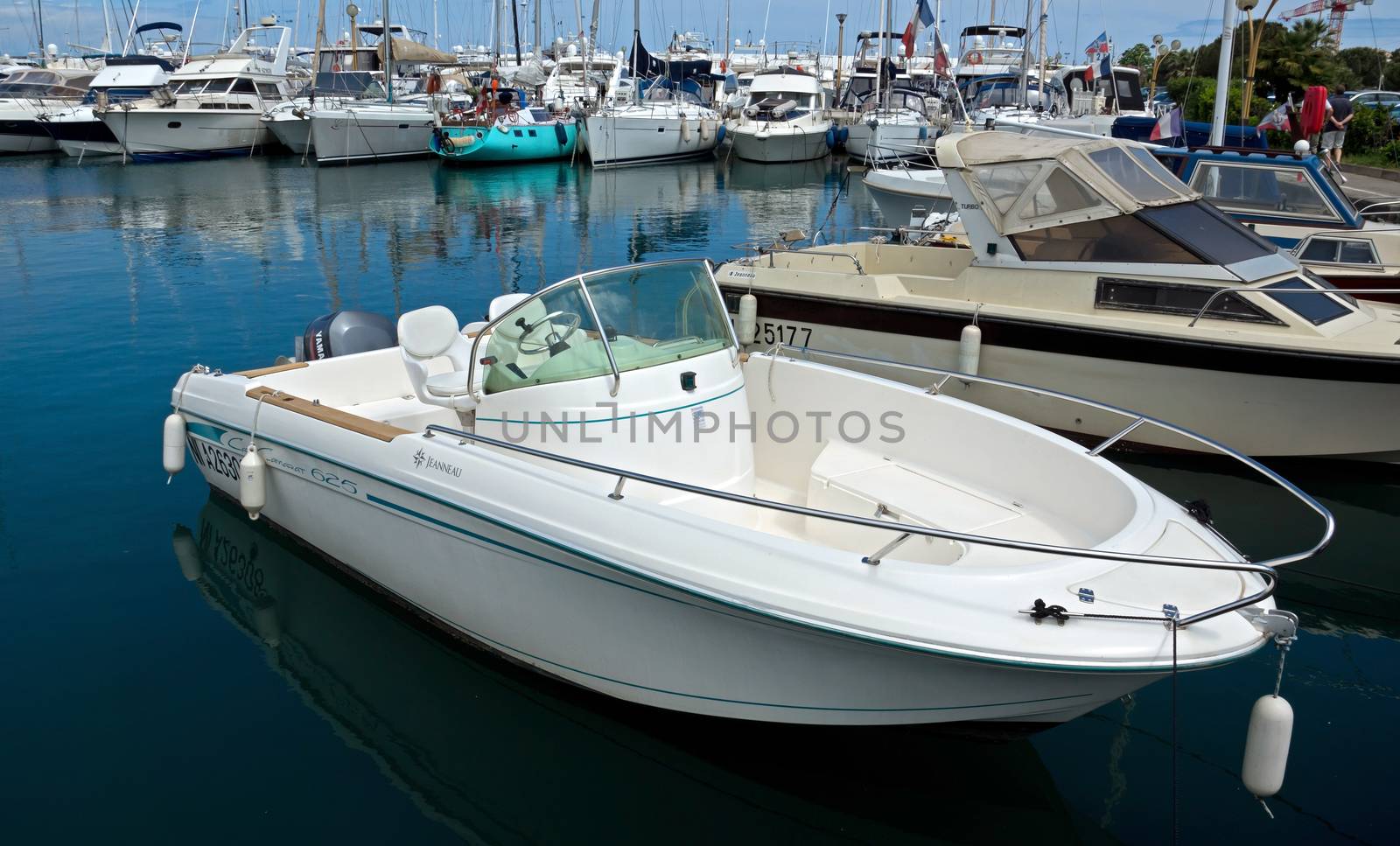 ANTIBES, FRANCE - MAY 6: Anchored boat in Port Grimaldi on May 6, 2013 in Antibes, France.

Antibes, France - May 6, 2013: Anchored boat in Port Grimaldi on the French Riviera.
