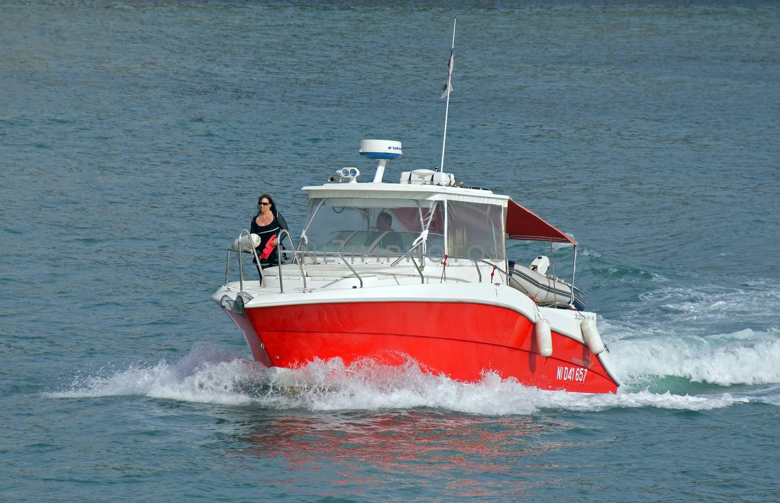 NICE, FRANCE - MAY 4: Escort boat for escorting ships in Port de Nice on May 4, 2013 in Nice, France. An escort boat is compulsory in port for all the cruising ships.

Nice, France - May 4, 2013: Escort boat for escorting ships in Port de Nice. An escort boat is compulsory in port for all the cruising ships. People on boat are escorting the ship that arrived to the place of mooring.