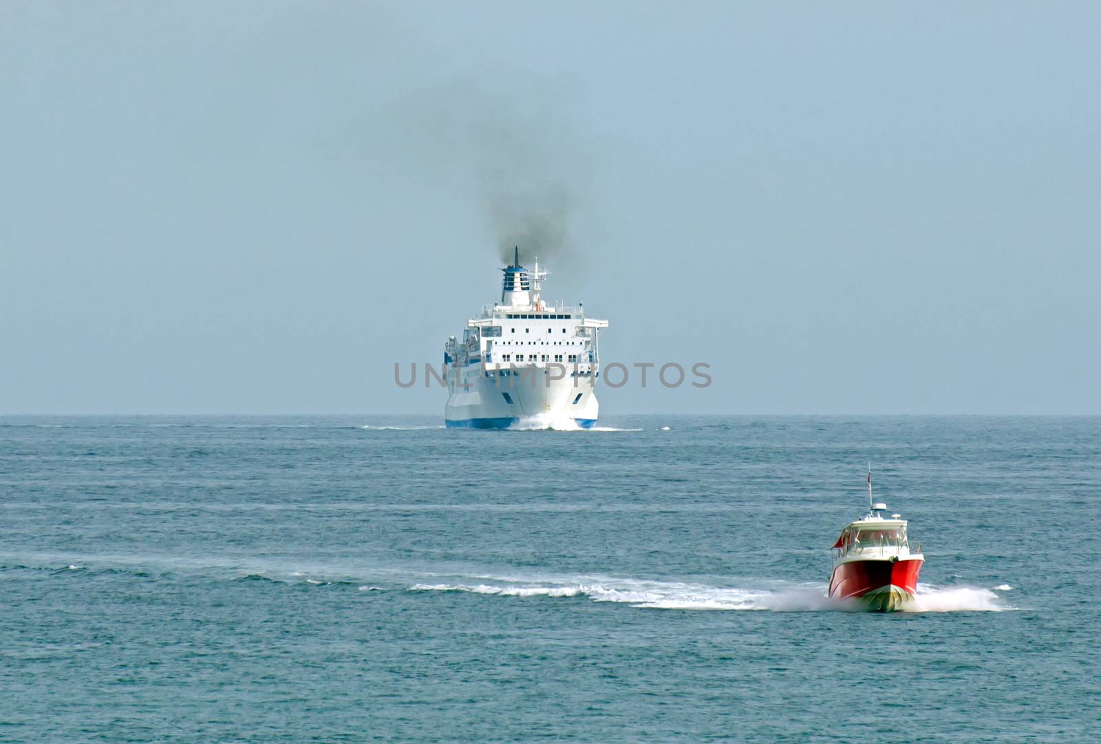 NICE, FRANCE - MAY 4: Escort boat for escorting ships in Port de Nice on May 4, 2013 in Nice, France. An escort boat is compulsory in port for all the cruising ships.

Nice, France - May 4, 2013: Escort boat for escorting ships in Port de Nice. An escort boat is compulsory in port for all the cruising ships.