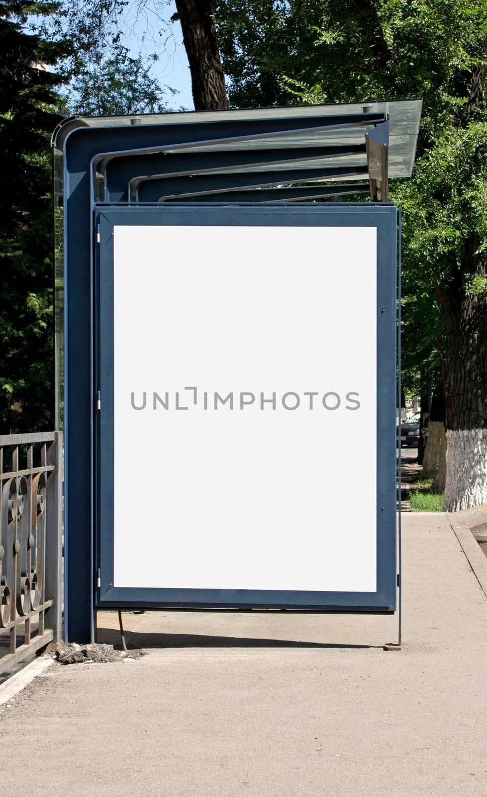 Blank Billboard on Bus Stop for your advertising situated (with work path)
