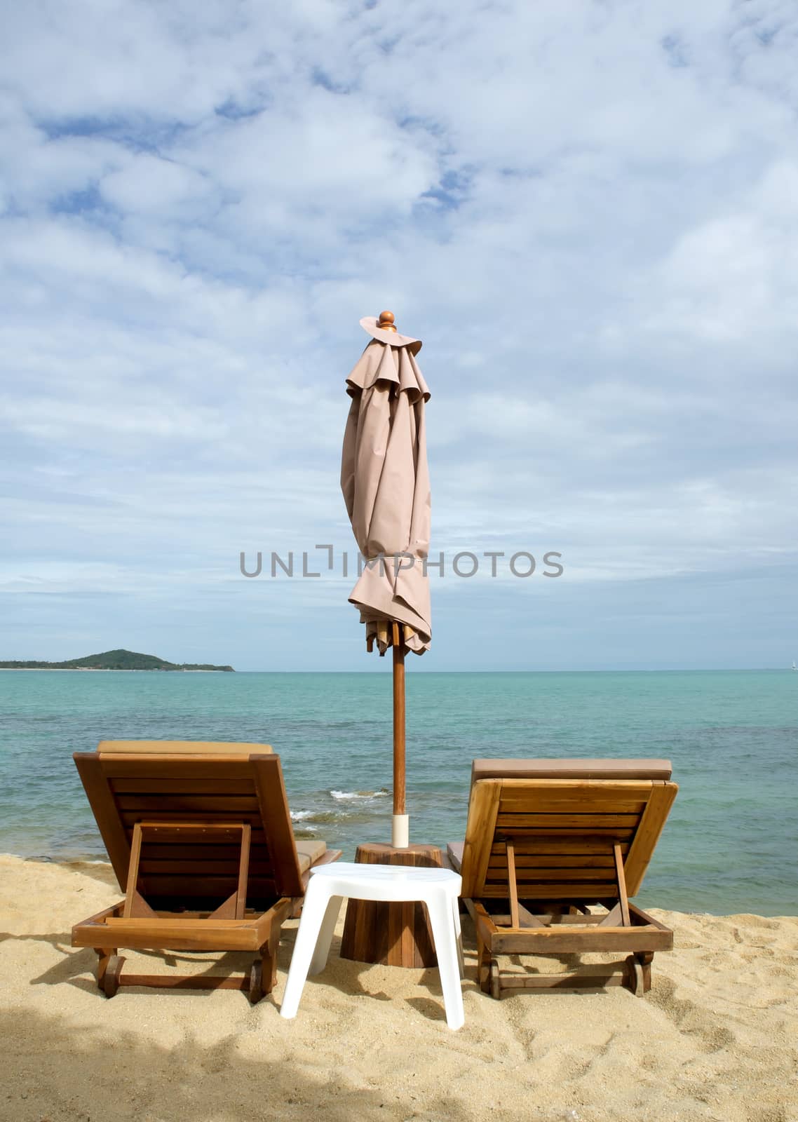 Chairs and umbrella on tropical beach