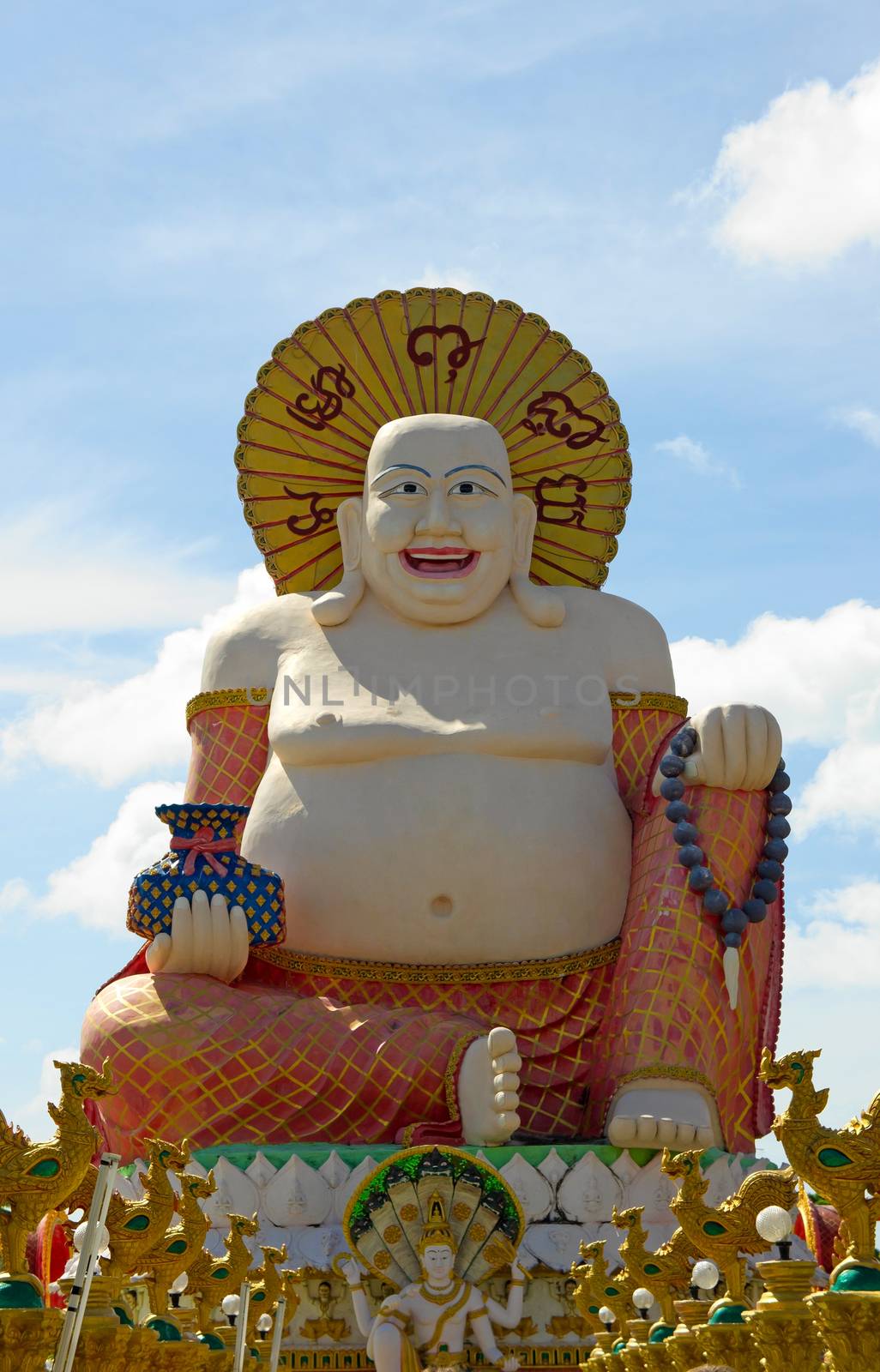 Smiling Buddha of wealth statue on Koh Samui, Thailand