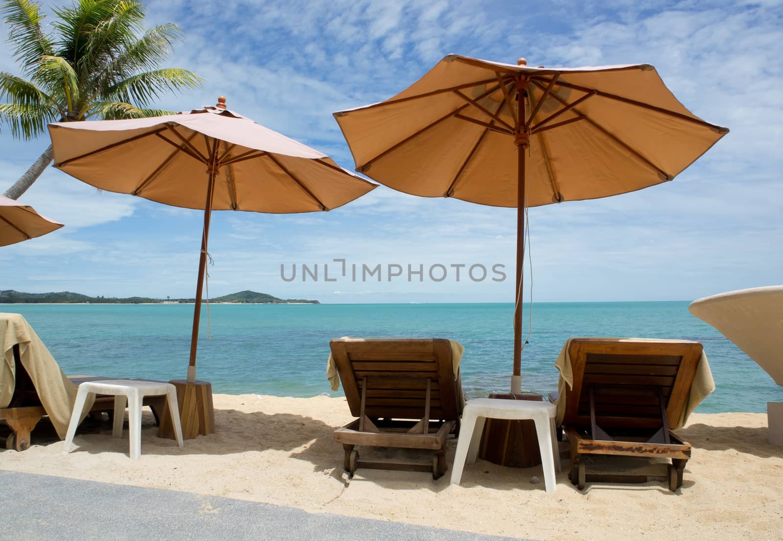 Chairs and umbrella on tropical beach