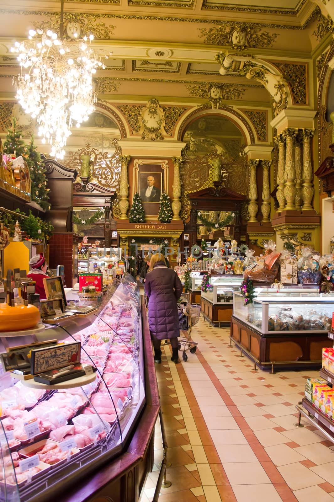 MOSCOW RUSSIA - DECEMBER 31: Interior view of the Eliseevsky store on December 31, 2011 in Moscow, Russia. Eliseevsky store in Moscow is very famous. Built before the Revolution 1917, Eliseev's Gastronome quickly became number one shopping mall in Moscow. 

Для IS: 
Moscow, Russia - December 31, 2011: Interior view of the Eliseevsky store. Eliseevsky store in Moscow is very famous. Built before the Revolution 1917, Eliseev's Gastronome quickly became number one shopping mall in Moscow. 