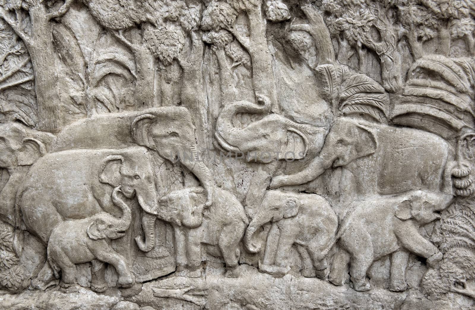 Bas-relief composition of stone elephants in Thailand
