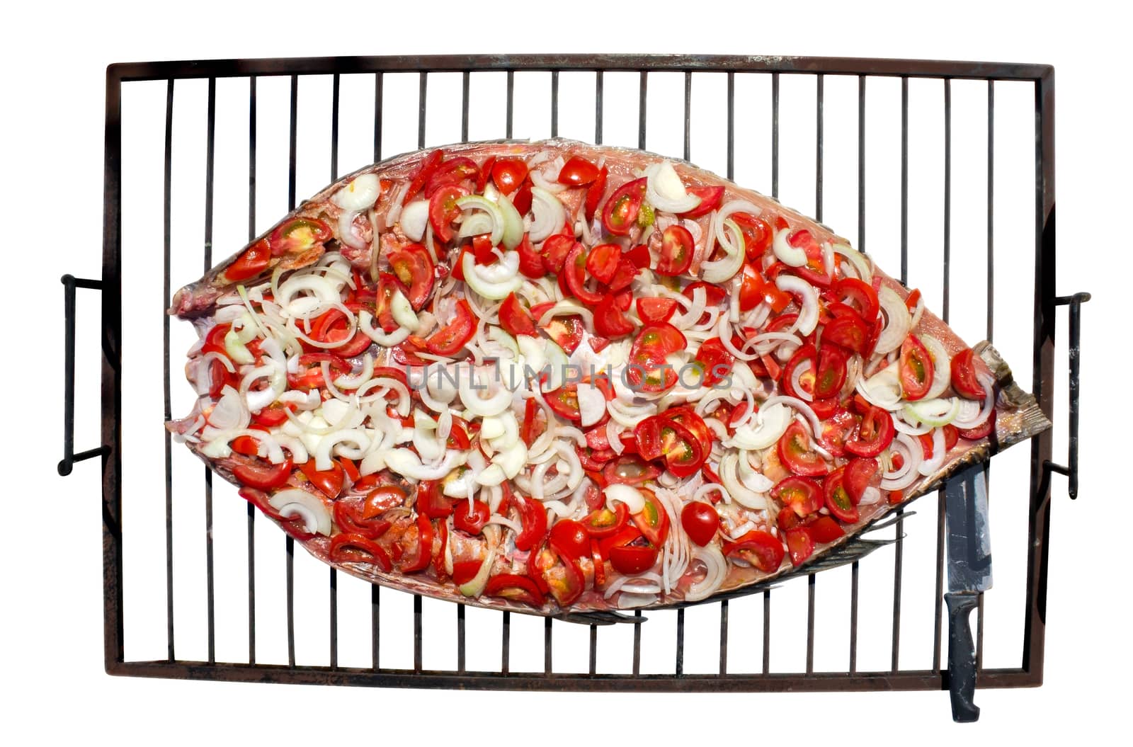Preparing fish for grilling on the grill. Isolated on white. Clipping path included.