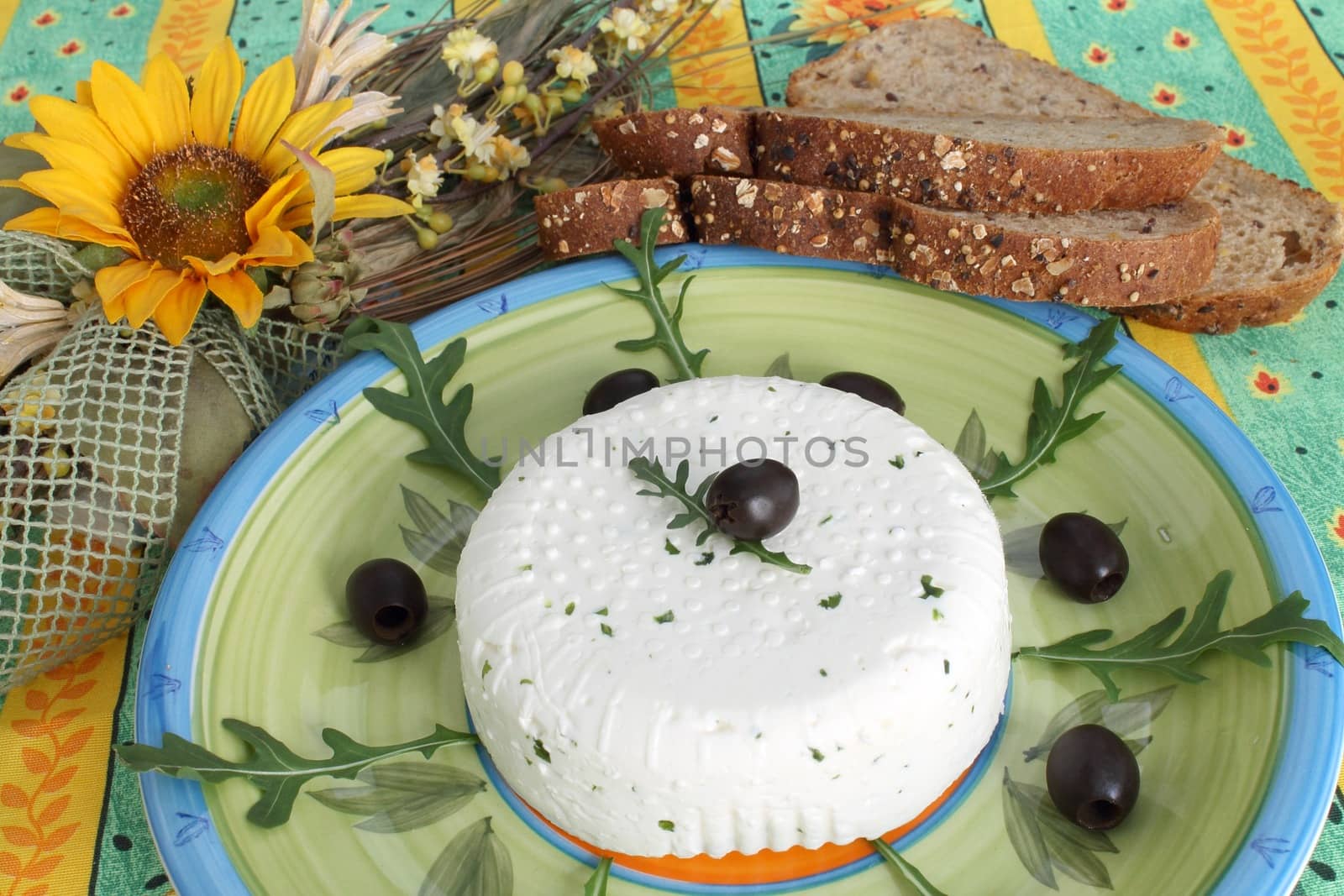 Fresh cheese with black olives