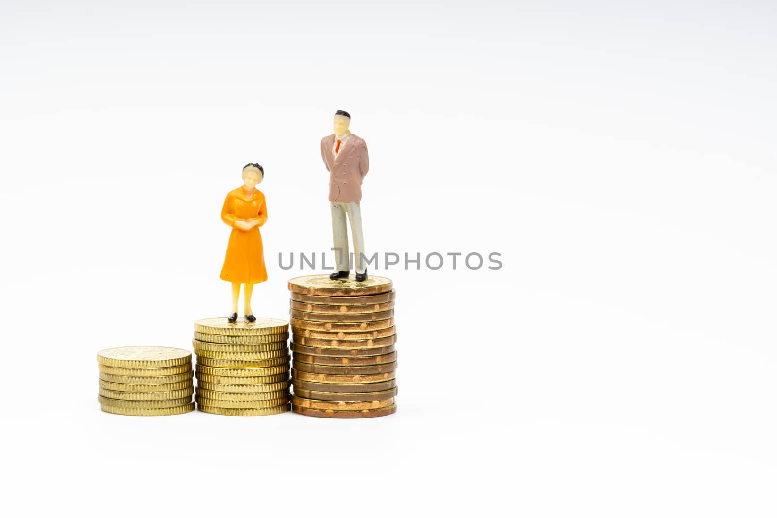 Miniature people standing on stacking coins with white background. Business and Lifestyle concepts.