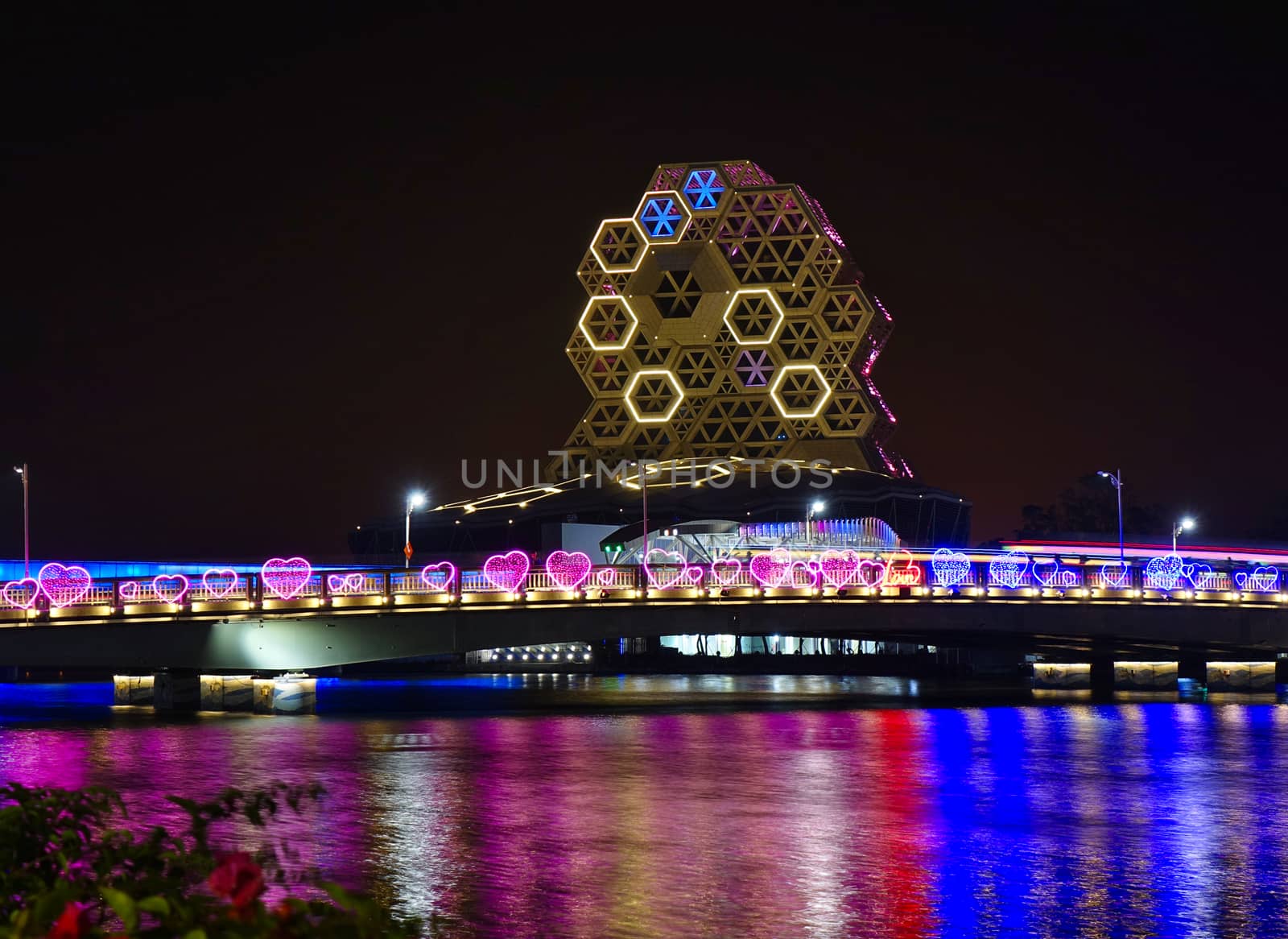 KAOHSIUNG, TAIWAN -- FEBRUARY 6, 2020:: Evening view of the Love River bridge with the illuminated pop music center during the Lantern Festival