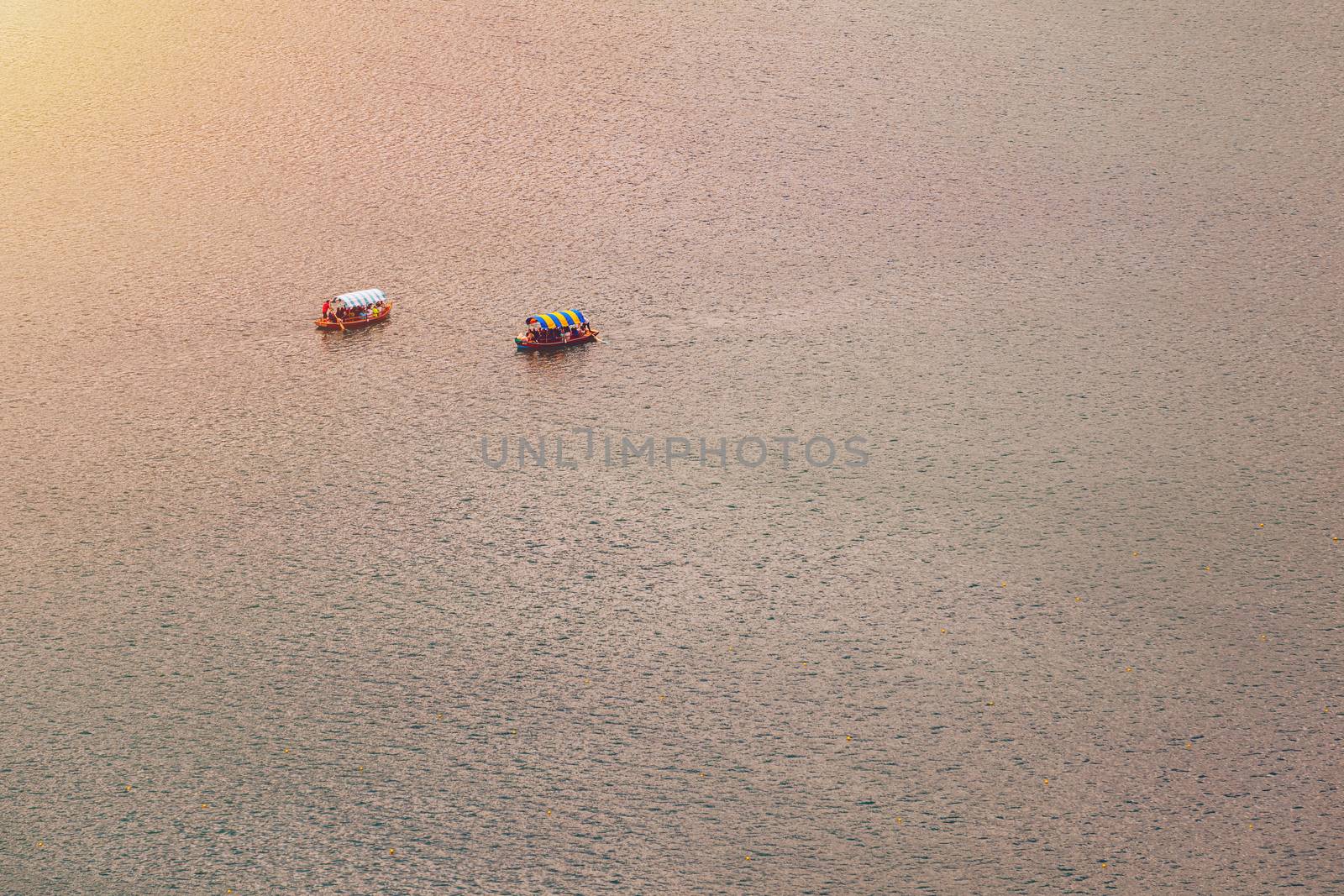 Lake Bled, Slovenia. Top view of a boat sailing in the lake. Bled lake is the most famous lake in Slovenia. Bled, Slovenia.