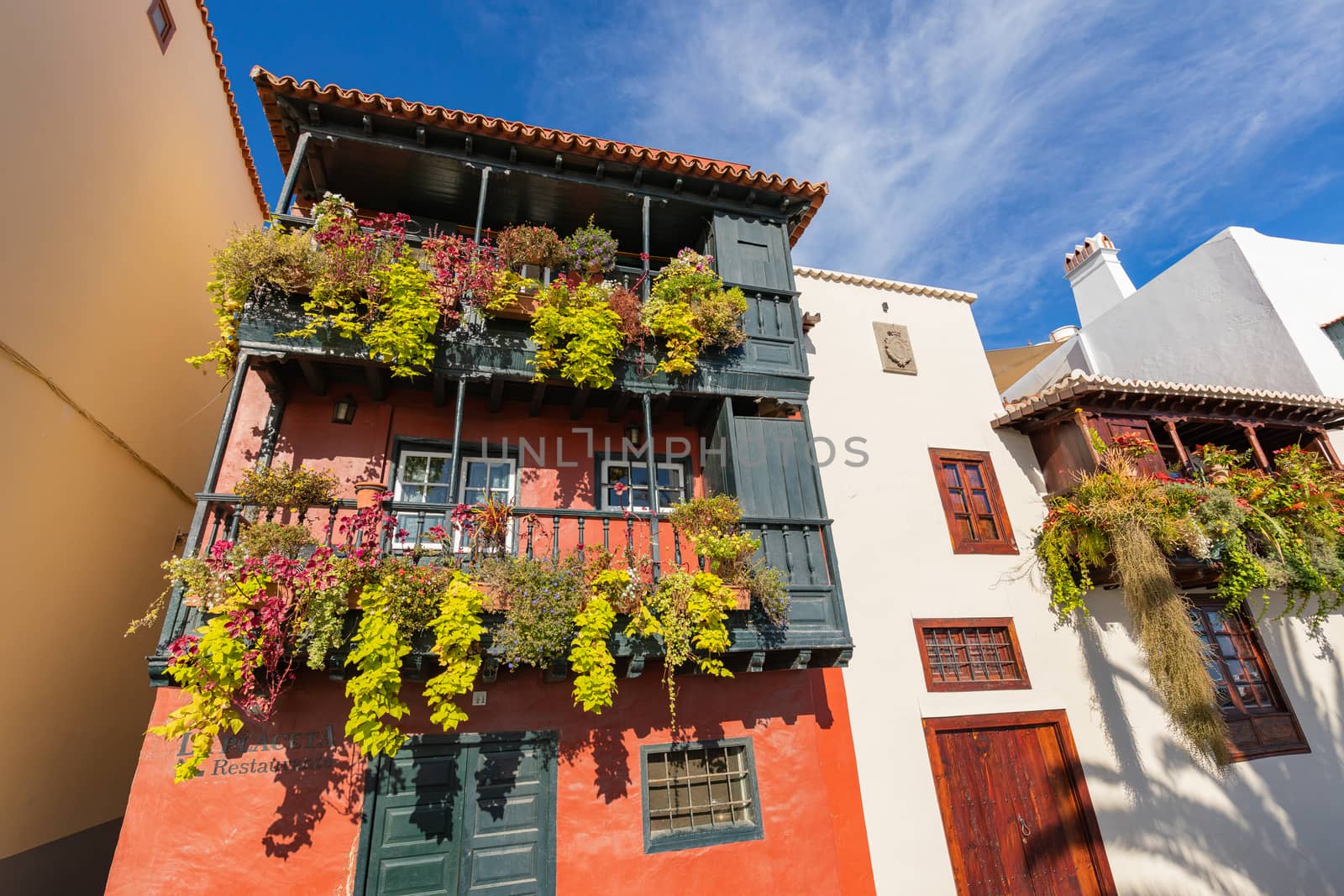 Famous ancient colorful balconies decorated with flowers in La Palma, Canary Islands, Spain.