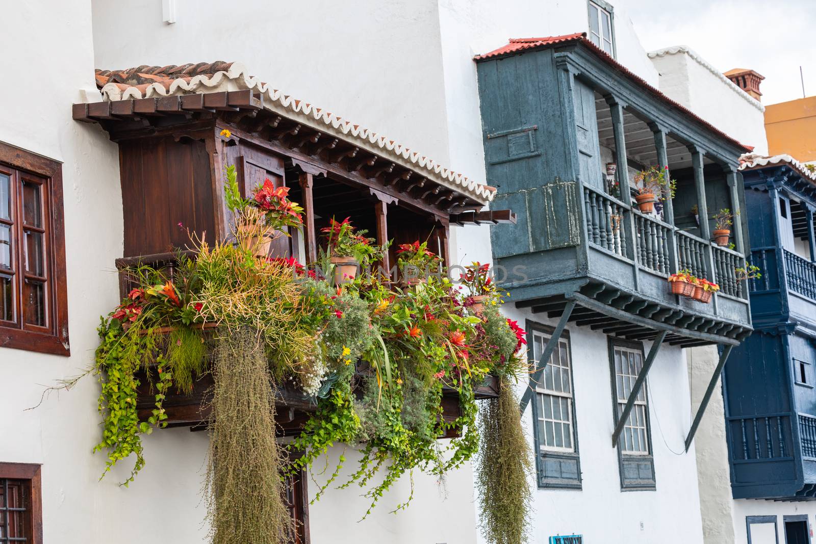 Famous ancient colorful balconies decorated with flowers. Santa Cruz - capital city of the island of La Palma, Canary Islands, Spain.