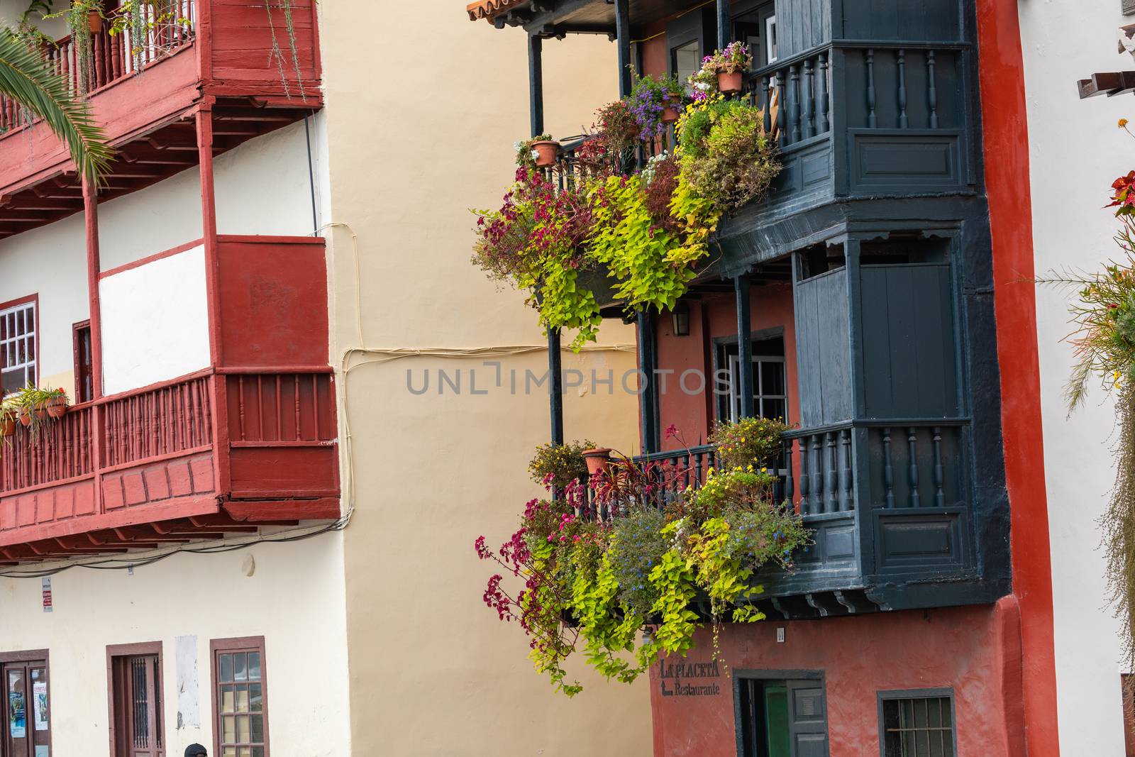 Famous ancient colorful balconies decorated with flowers. Santa  by mariusz_prusaczyk