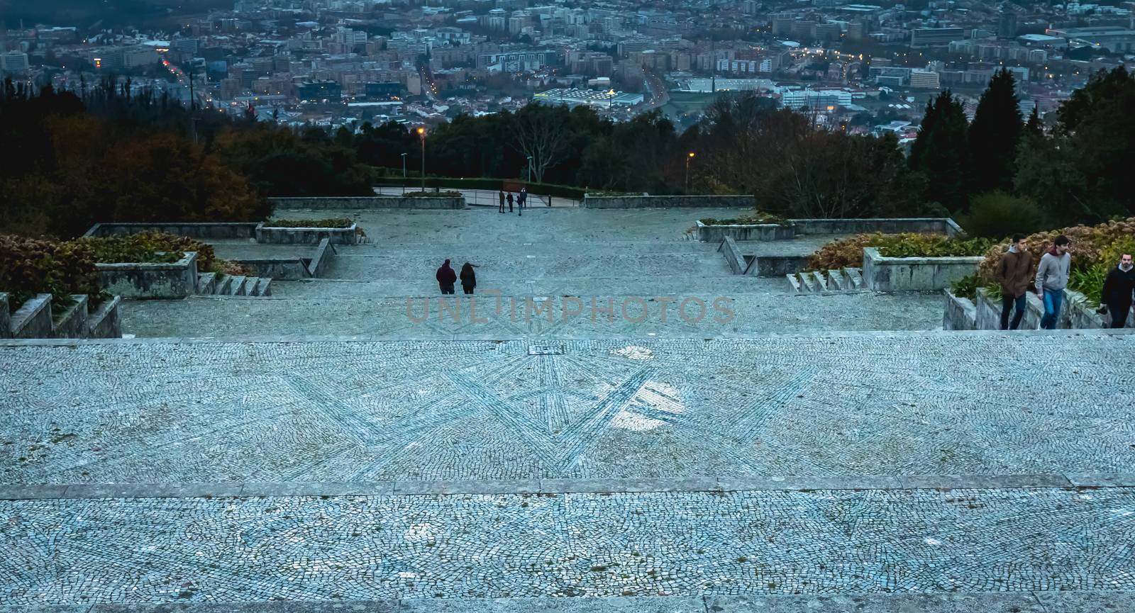 Braga, Portugal - December 1, 2018: People walk in the sanctuary of Our Lady of Sameiro near Braga at dusk