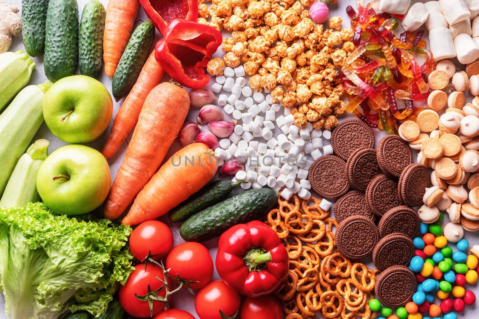 Healthy or unhealthy food concept. Fruits and vegetables vs sweets top view flat lay