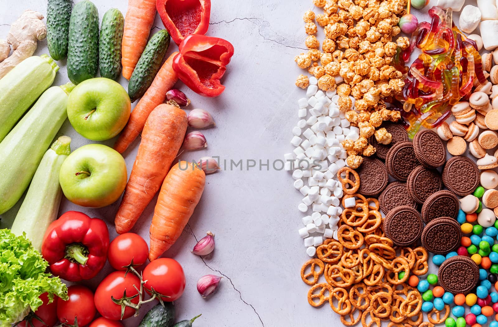 Healthy and unhealthy food concept. Fruits and vegetables vs sweets top view flat lay